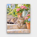 Tabby on the Garden Steps paint by numbers kit of a tabby cat lounging on stone garden steps beside flower pots and a watering can
