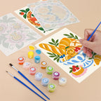 Filling in a Tablecloth Treats mini canvas with numbered acrylic paints and a fine brush