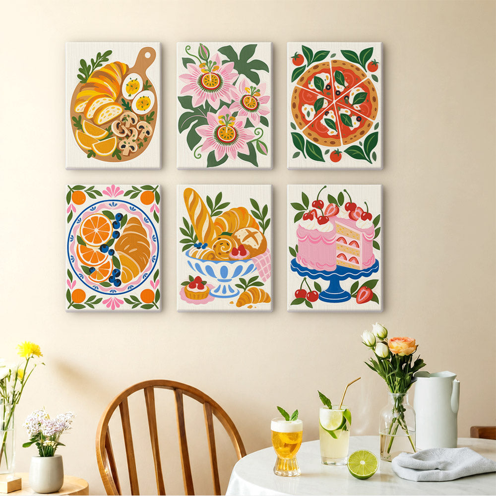 Tablecloth Treats mini paintings displayed as a gallery wall in a sunny kitchen