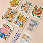 Tablecloth Treats mini paint by numbers kit with six numbered canvases, acrylic paints, brushes and layout
