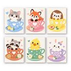 Teacup Critters mini paint by numbers set: six baby animals in pastel teacups, including a kitten, fox, hedgehog, raccoon, duckling and bunny