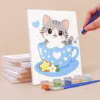 Painting a Teacup Critters mini canvas propped up beside numbered acrylic paints