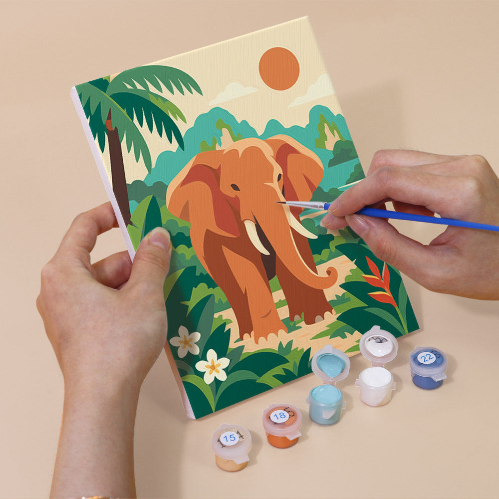 Hand holding a Thailand Escape mini canvas while painting the details
