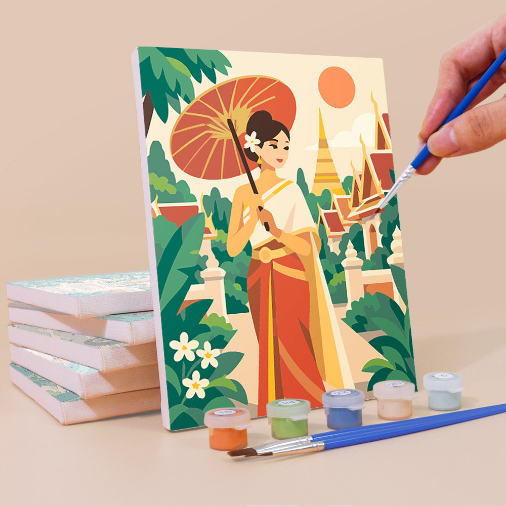 Painting a Thailand Escape mini canvas propped up beside numbered acrylic paints