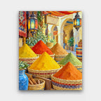 The Spice Stall paint by numbers kit of colorful cones of spice in woven baskets under hanging lanterns at a market stall