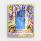 The Wisteria Door paint by numbers kit of a blue cottage door framed by hanging purple wisteria with potted flowers