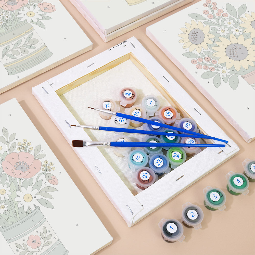 Numbered paint pots and brushes on a pre-stretched Tin Can Bouquets mini canvas