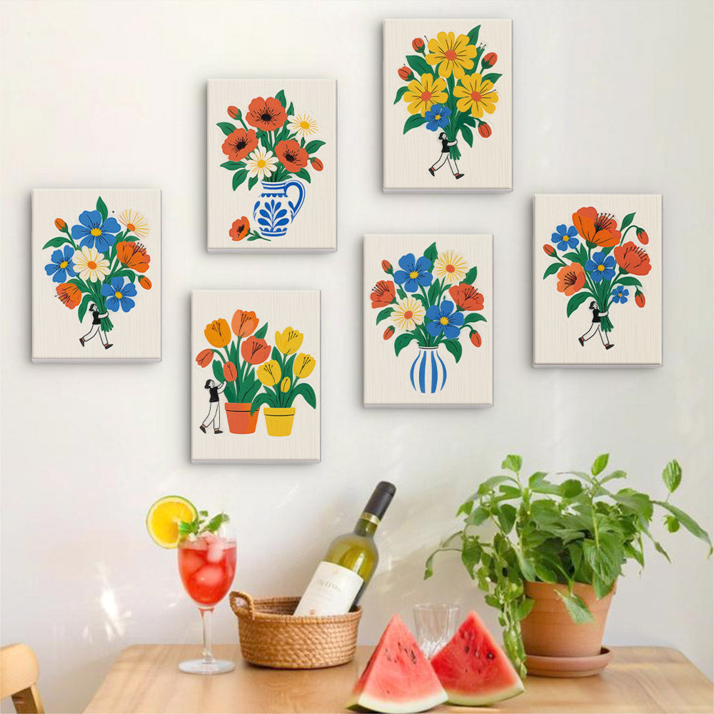 Six finished Tiny Gardeners mini paintings hung on a wall above a table