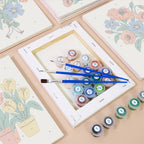 Numbered paint pots and brushes on a pre-stretched Tiny Gardeners mini canvas