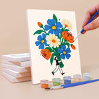 Painting a Tiny Gardeners mini canvas propped up beside numbered acrylic paints