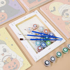 Numbered paint pots and brushes on a pre-stretched Tiny Trick-or-Treaters mini canvas