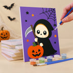 Painting a Tiny Trick-or-Treaters mini canvas propped up beside numbered acrylic paints