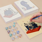 Painting one of the Tiny Worlds designs next to a stack of mini canvases
