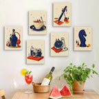 Six finished Tiny Worlds mini paintings hung on a wall above a table