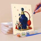 Painting a Tiny Worlds mini canvas propped up beside numbered acrylic paints