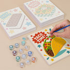 Painting one of the Treat Time designs next to a stack of mini canvases