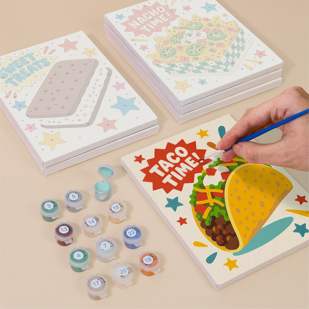 Painting one of the Treat Time designs next to a stack of mini canvases