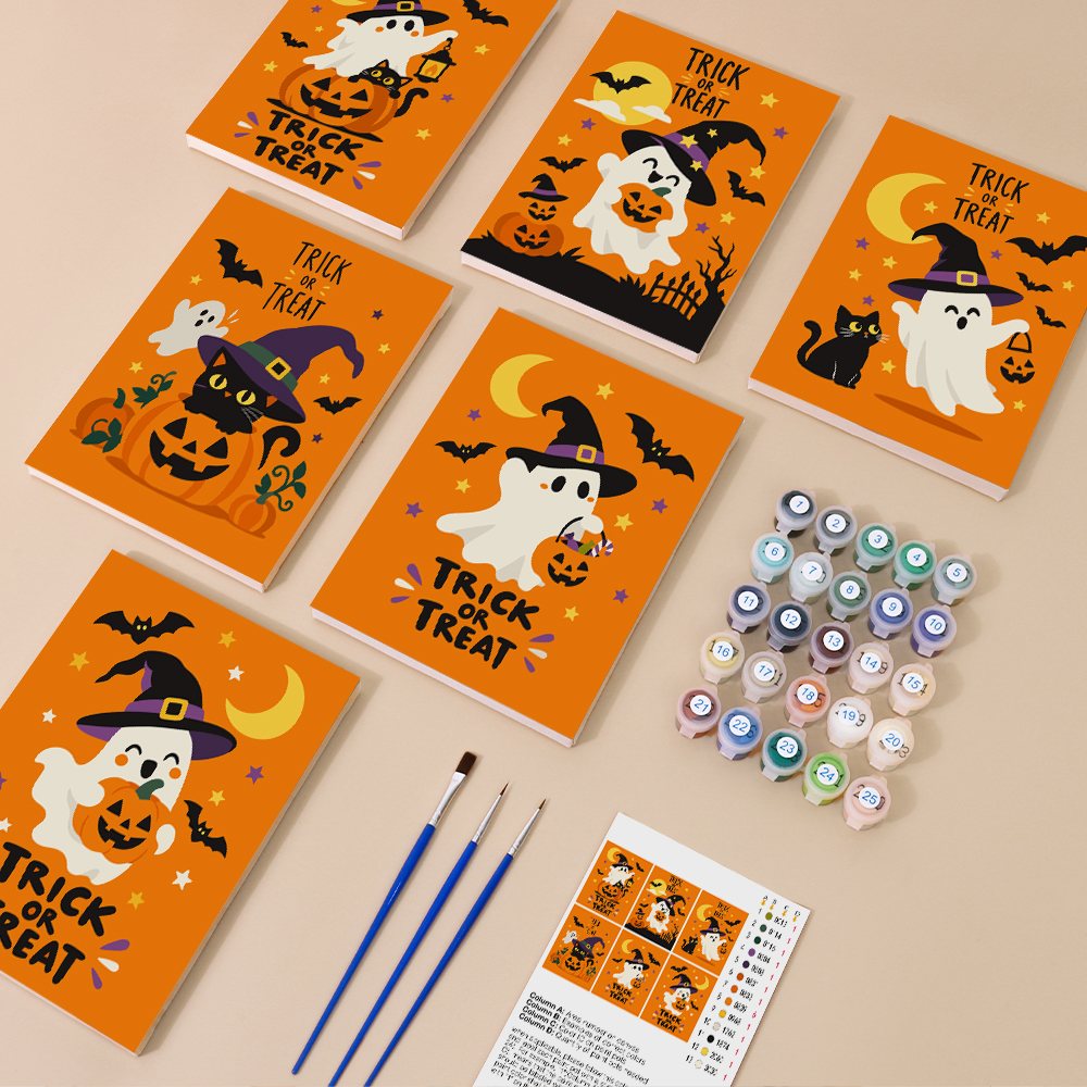 Painting one of the Trick or Treat Ghosts designs next to a stack of mini canvases