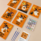 Painting one of the Trick or Treat Ghosts designs next to a stack of mini canvases