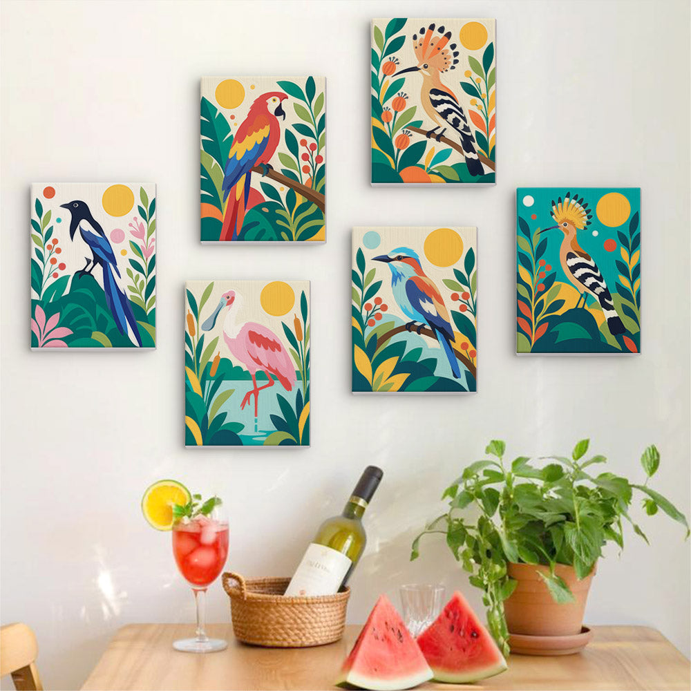 Six finished Tropical Birds mini paintings hung on a wall above a table