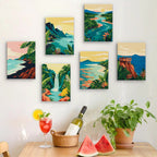 Six finished Tropical Coastlines mini paintings hung on a wall above a table