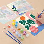 Filling in a Tropical Cutouts mini canvas with numbered acrylic paints and a fine brush
