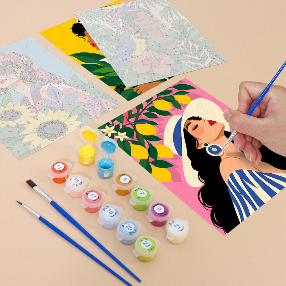 Filling in a Tropical Muses mini canvas with numbered acrylic paints and a fine brush
