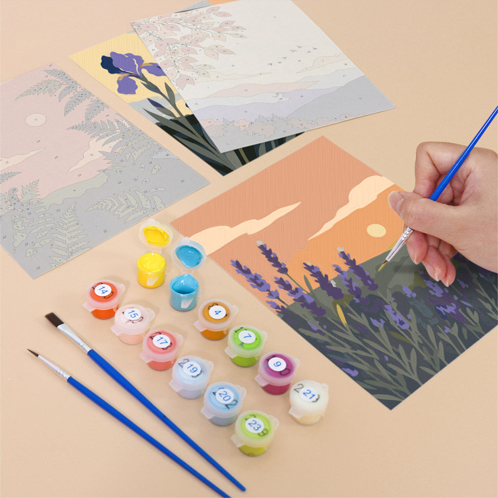Filling in a Twilight Meadows mini canvas with numbered acrylic paints and a fine brush