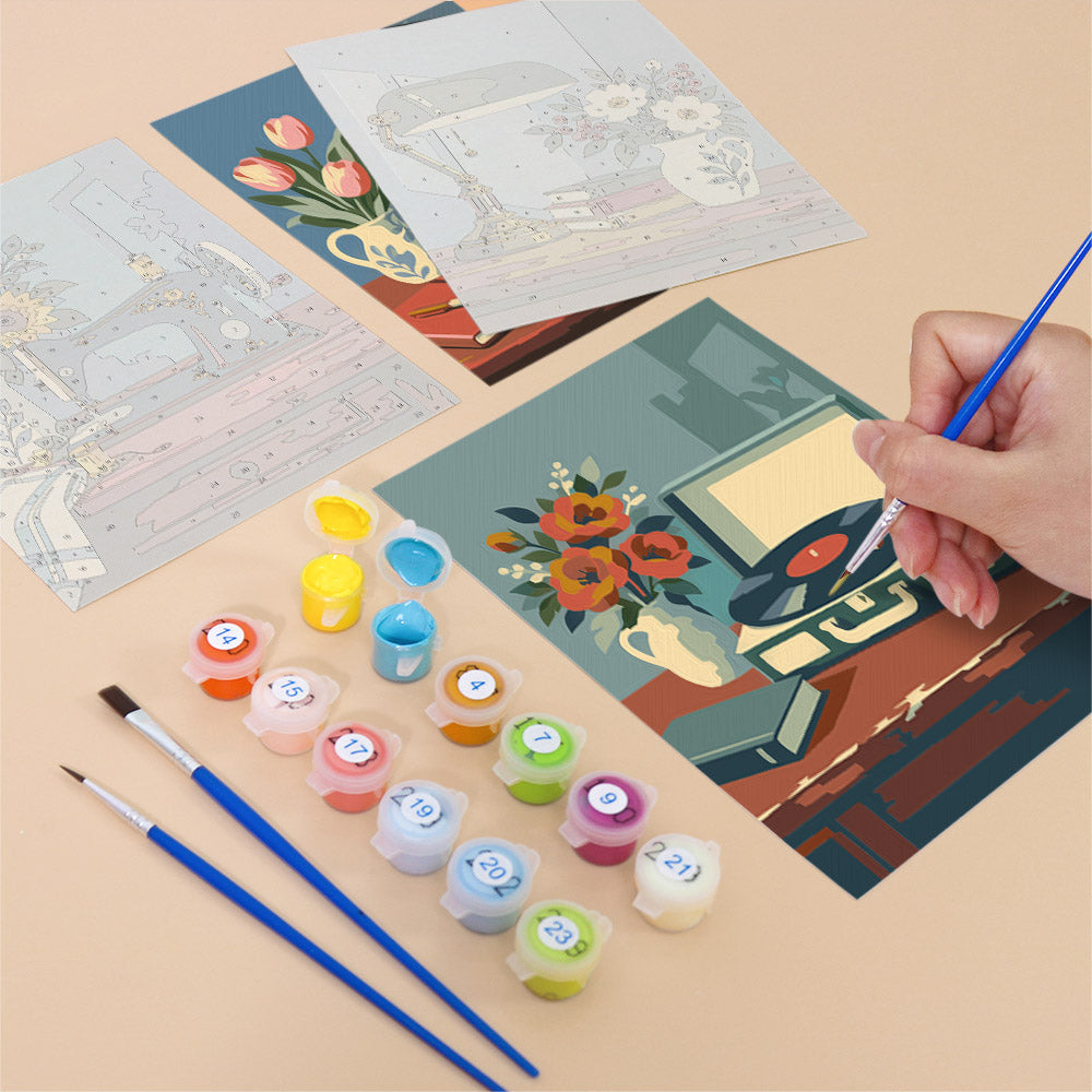Filling in a Vintage Keepsakes mini canvas with numbered acrylic paints and a fine brush