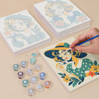Painting one of the Vintage Sweethearts designs next to a stack of mini canvases