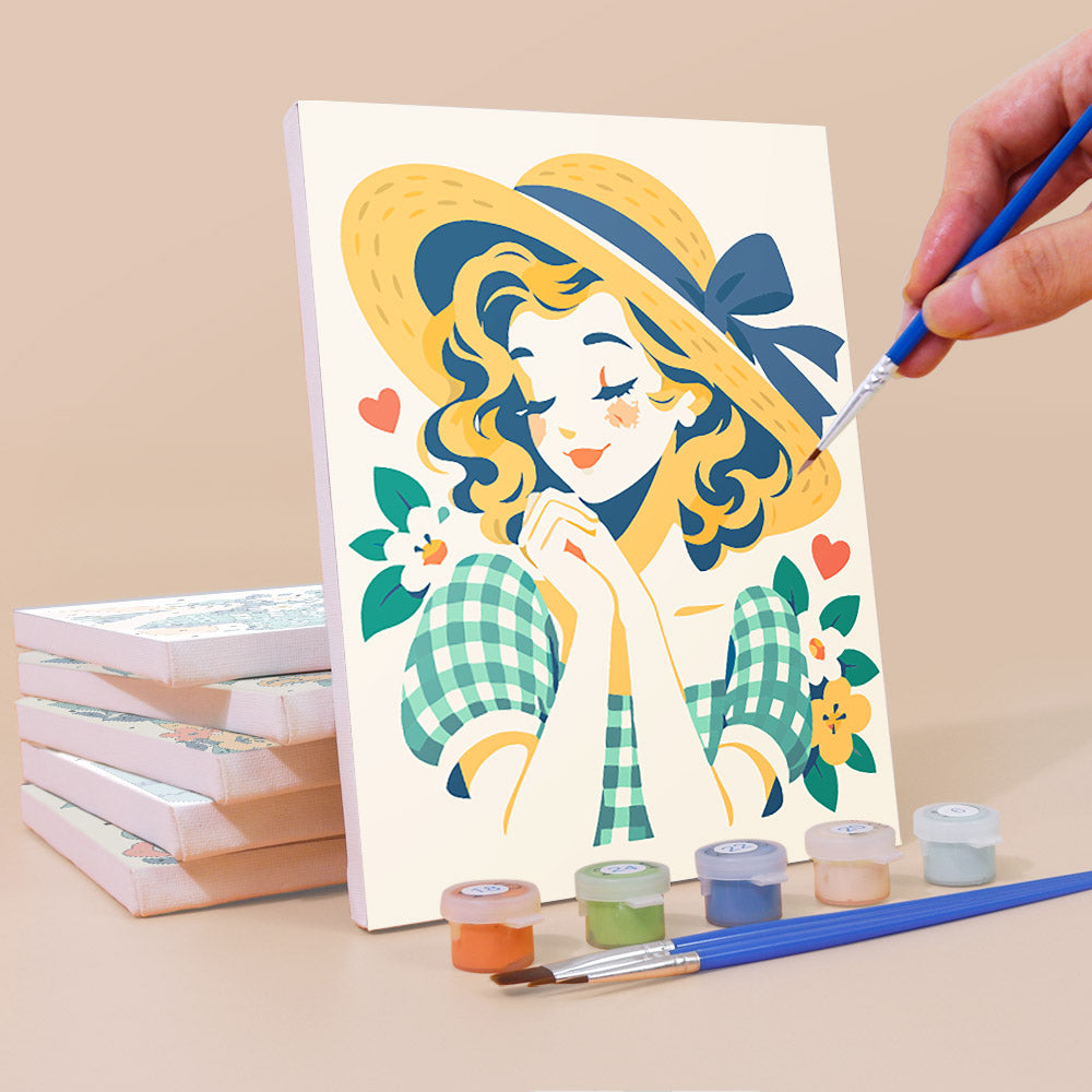 Painting a Vintage Sweethearts mini canvas propped up beside numbered acrylic paints