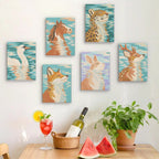 Six finished Water Reflections mini paintings hung on a wall above a table