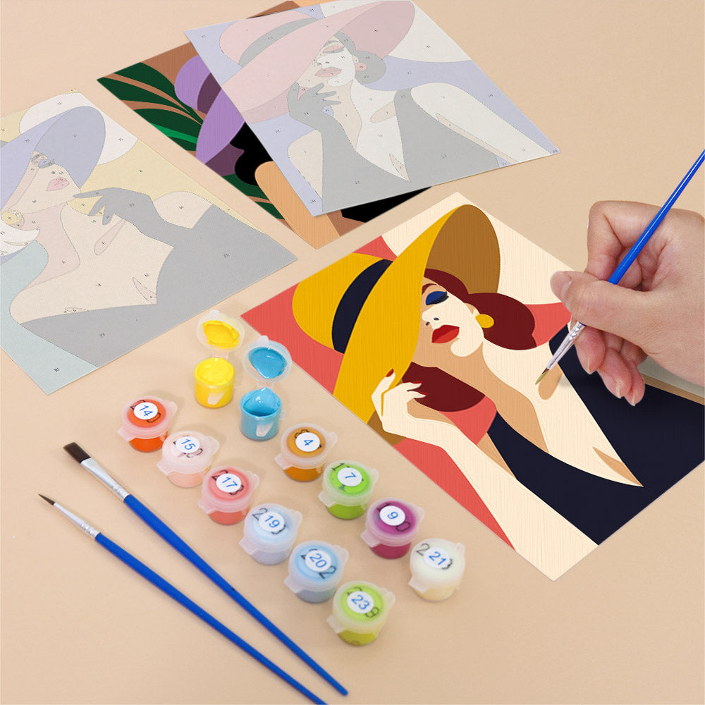 Filling in a Wide-Brim Glamour mini canvas with numbered acrylic paints and a fine brush