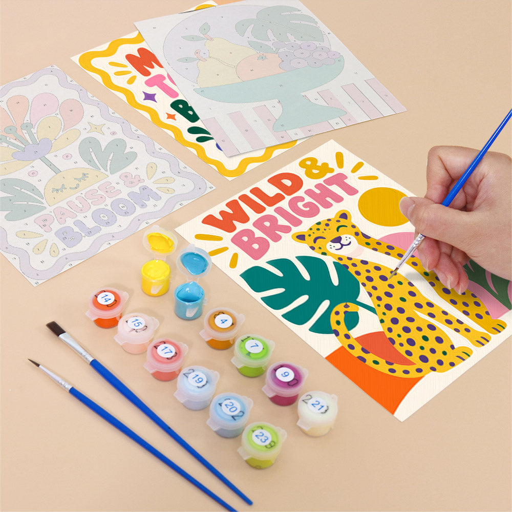 Filling in a Wild & Bright mini canvas with numbered acrylic paints and a fine brush