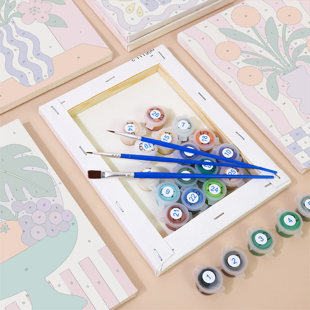 Numbered paint pots and brushes on a pre-stretched Wild & Bright mini canvas