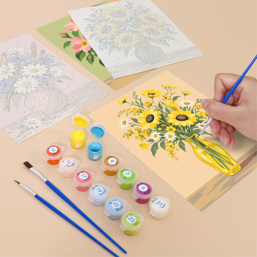 Filling in a Wildflower Vases mini canvas with numbered acrylic paints and a fine brush