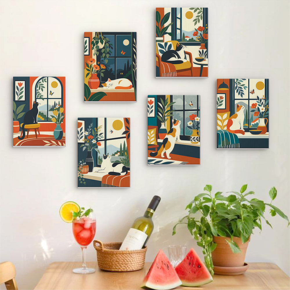 Six finished Window Cats mini paintings hung on a wall above a table