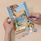 Hand holding a Windows to the Sea mini canvas while painting the details