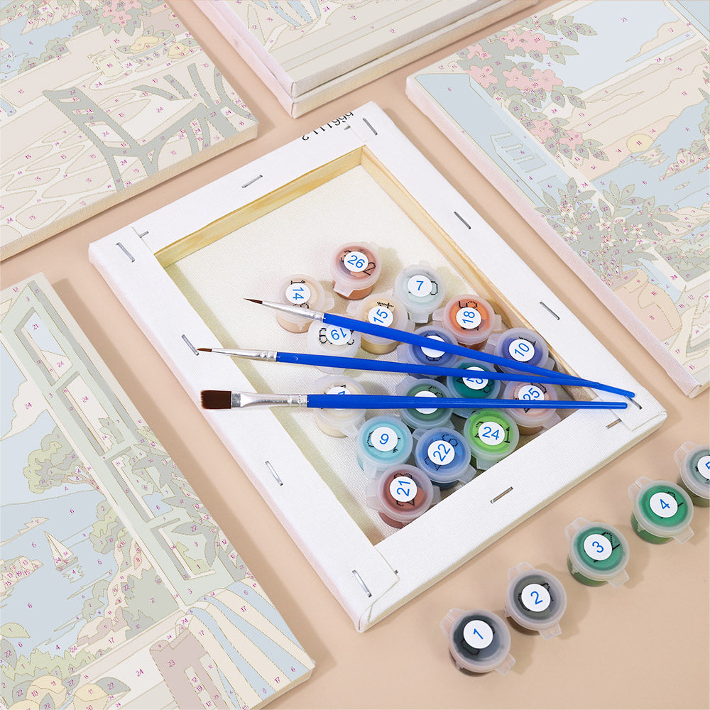 Numbered paint pots and brushes on a pre-stretched Windows to the Sea mini canvas
