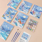 Winter Wonderland mini paint by numbers kit with six numbered canvases, acrylic paints, brushes and layout
