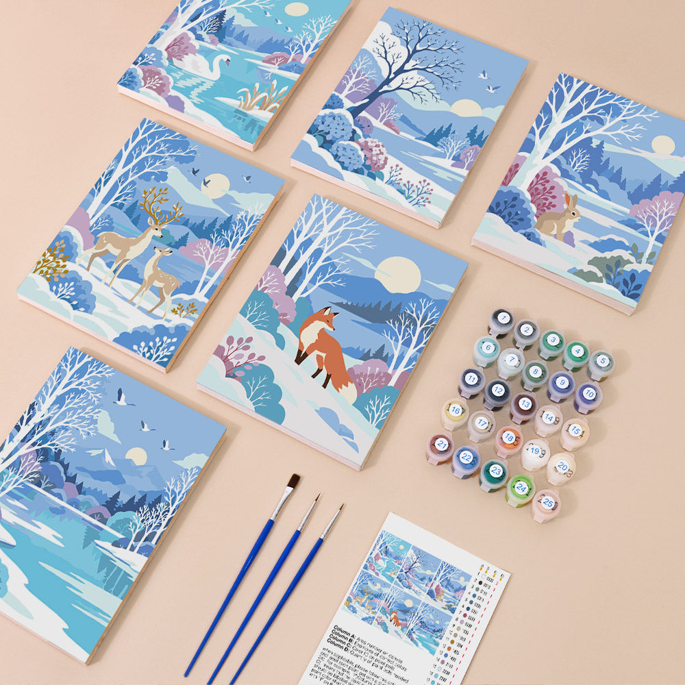 Winter Wonderland mini paint by numbers kit with six numbered canvases, acrylic paints, brushes and layout