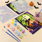 Filling in a Witching Windows mini canvas with numbered acrylic paints and a fine brush