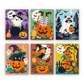 Witchy Pumpkin Patch mini paint by numbers set: six playful witchy pumpkin scenes with a ghost, witch legs, a raccoon, a black cat, a little witch and stacked pumpkins
