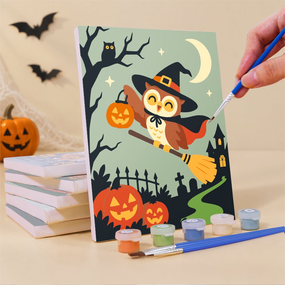 Painting a Woodland Costume Party mini canvas propped up beside numbered acrylic paints