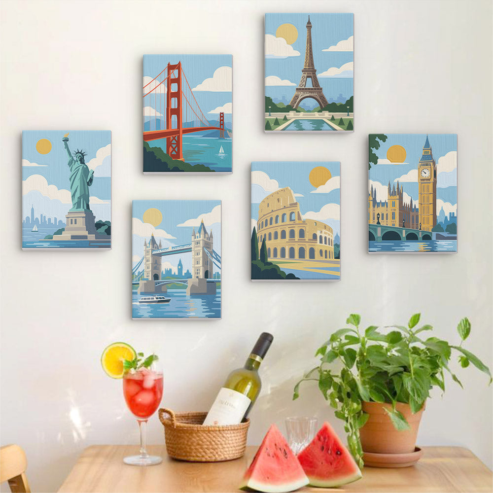 Six finished World Landmarks mini paintings hung on a wall above a table