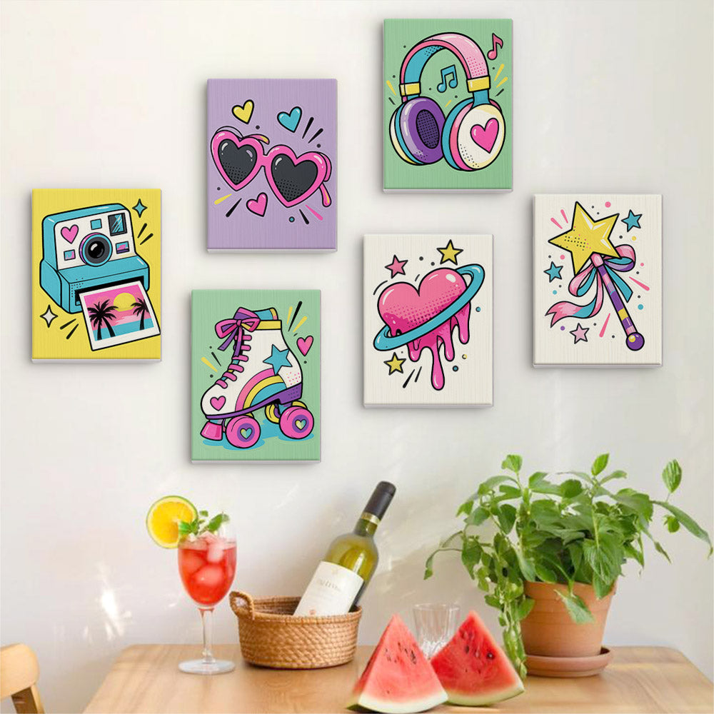 Six finished Y2K Doodles mini paintings hung on a wall above a table