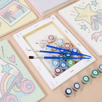Numbered paint pots and brushes on a pre-stretched Y2K Doodles mini canvas