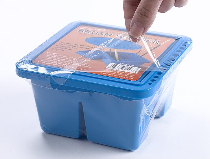Brush washer detail showing the lid that helps prevent spills while you paint by numbers