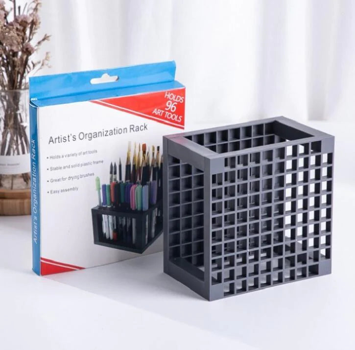 Paint by numbers brush rack filled with brushes and tools, neatly organized on a desk